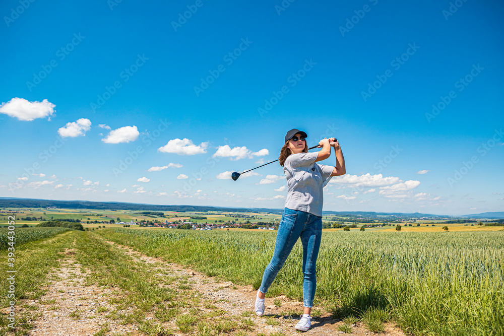Young woman playing golf at countryside Young woman playing golf at countryside