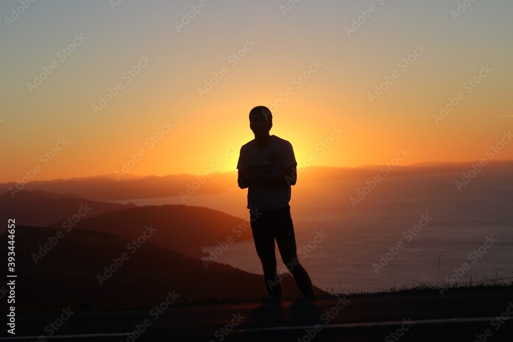 silhouette of a couple at sunset in the mountain silhouette of a couple at sunset in the mountain