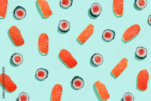 Salman sushi nigiri and maki pattern on mint green background photo