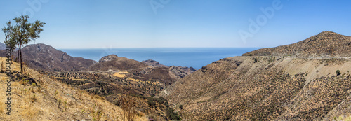 Greece, Crete, Lentas, Panorama of brown coastal hills in summer photo