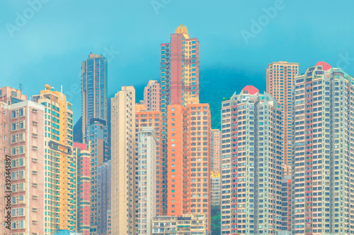 Modern buildings against blue sky in city, Hong Kong photo