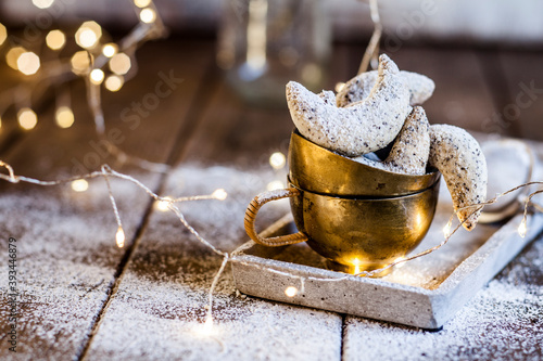 Almond cookies with powdered sugar and poppy seeds photo