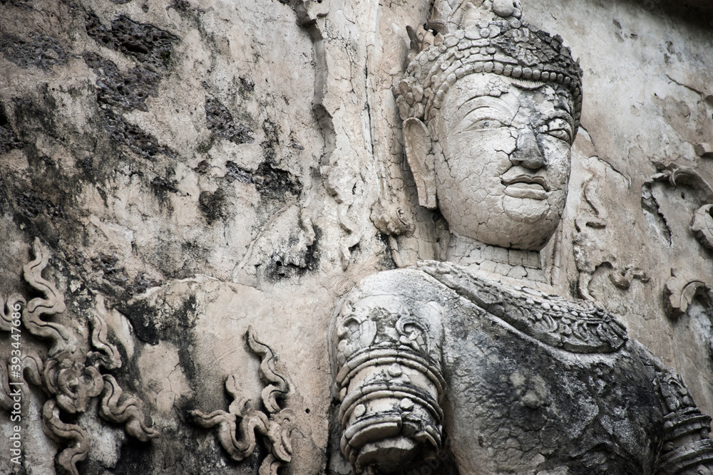 A Buddha statue on the wall at Wat Sam Yot, Chiang Mai