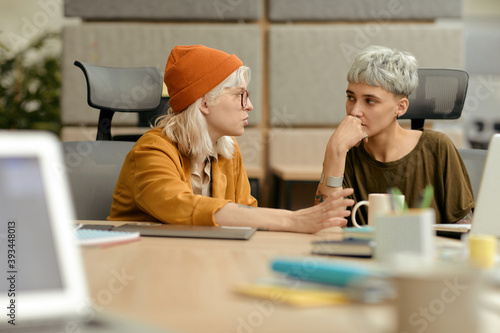Two Creative Women Discussing Their Ideas