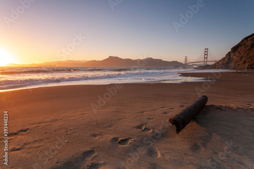 Dusk at Bakers Beach San Francisco California with the Golden Gate Bridge in the distance photo