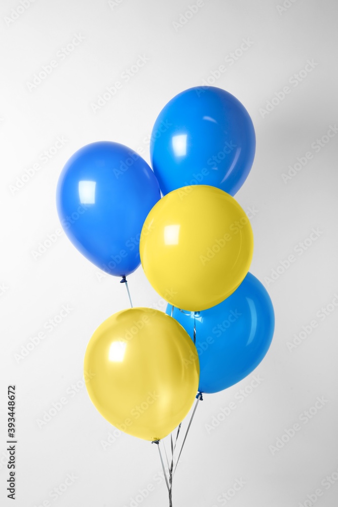 Many balloons in colors of Ukrainian flag on light background Many balloons in colors of Ukrainian flag on light background