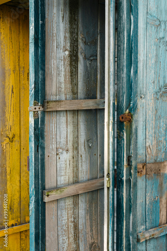 Texture of woonden green painted closet in decay photo