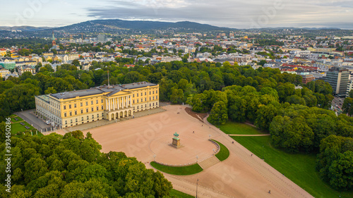 Oslo, Norway. Beautiful panoramic aerial view photo from flying drone to of the Royal Palace and Statue of King Karl Johan Oslo. In the background the castle park, the city and the mountains (Series)