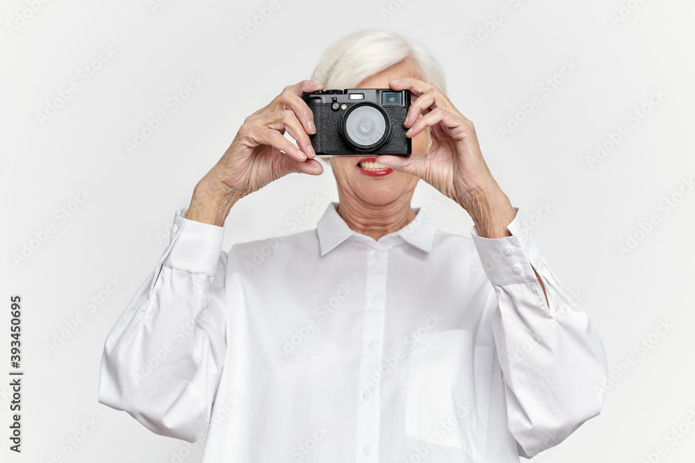 Happy Senior Lady Taking Photos