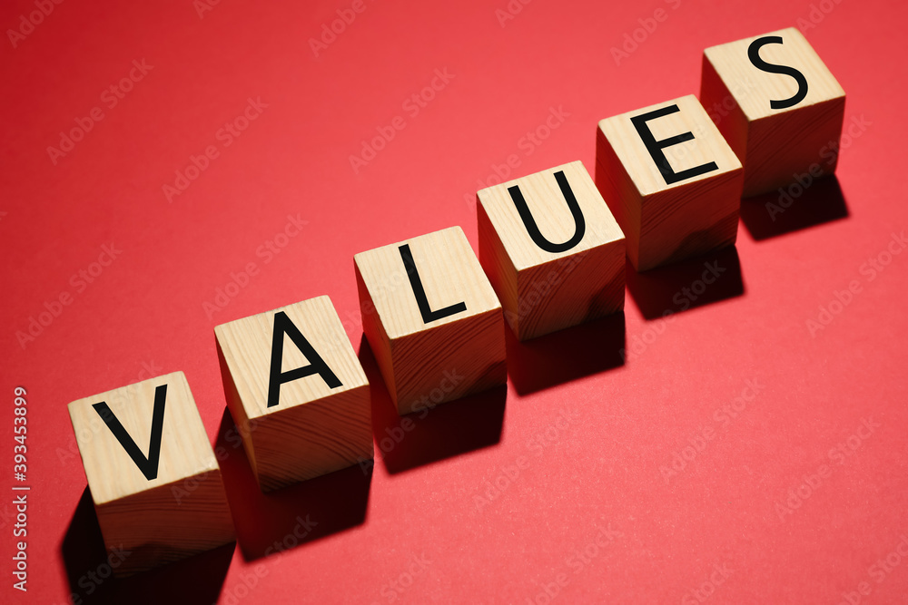 Obraz premium Wooden cubes with word VALUES on red background