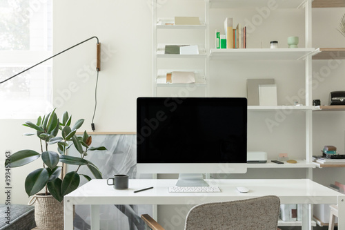 minimal home office with imac in bright organized studio photo