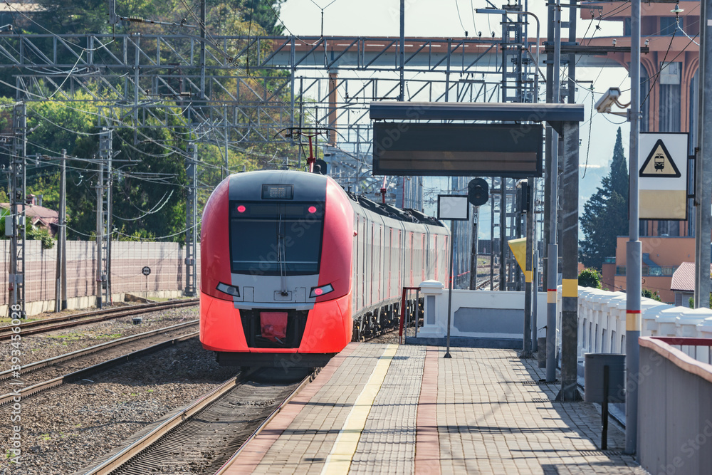 Passenger train departs from Dagomys station. Sochi.