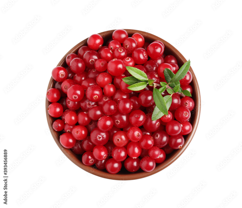 Fresh ripe cranberries with leaves in bowl isolated on white, top view Fresh ripe cranberries with leaves in bowl isolated on white, top view