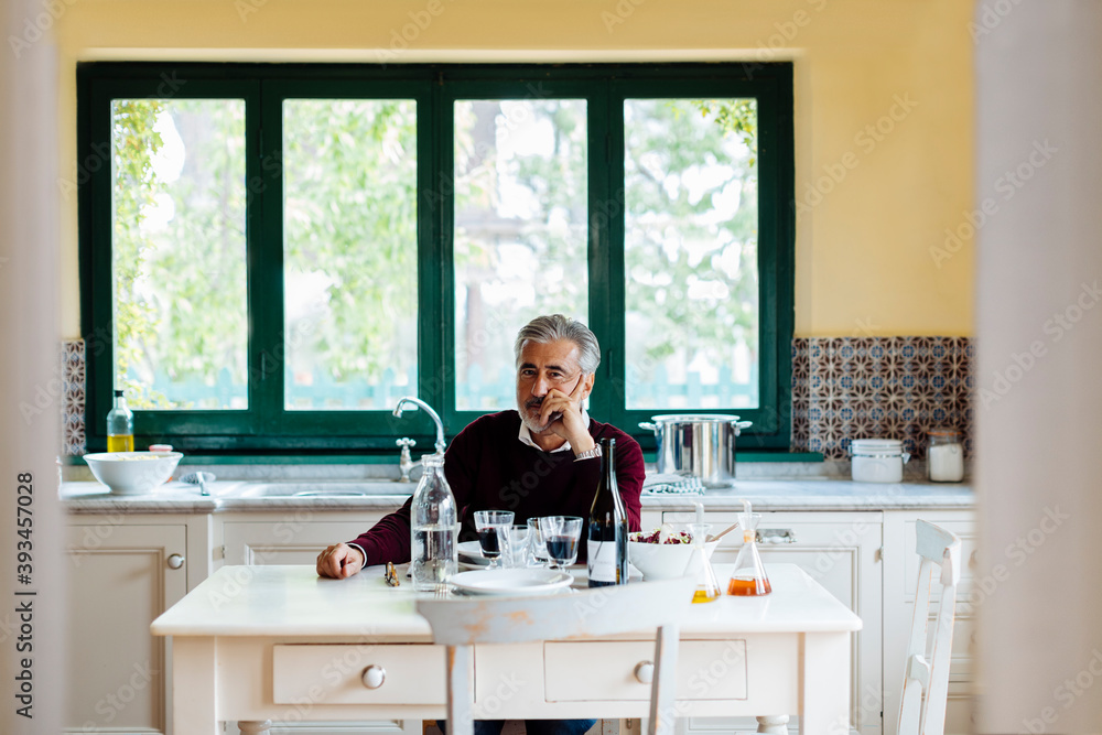 Thoughtful man waiting for lunch Thoughtful man waiting for lunch