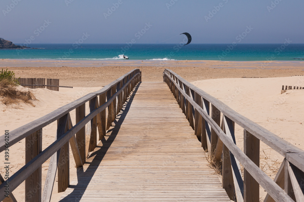 kite surfer and beach pier