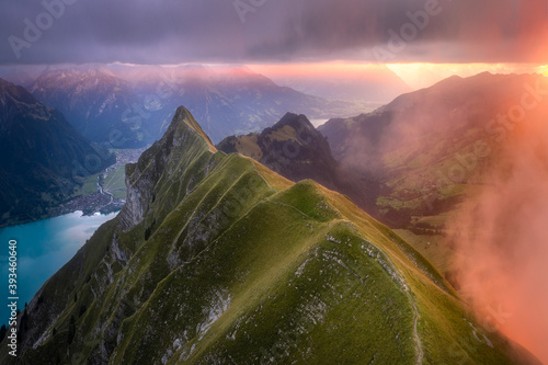 Mystic and colorful sunset mood over mountain ridge photo