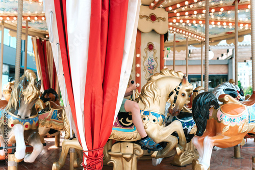 A child on the city carousel. photo