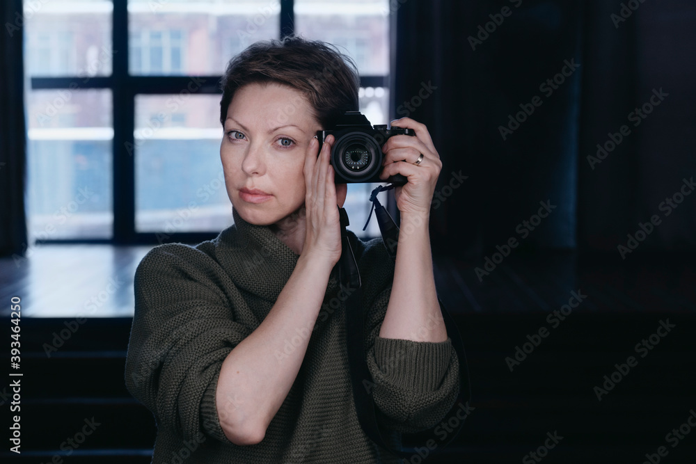 Female photographer with a camera. Female photographer with a camera.