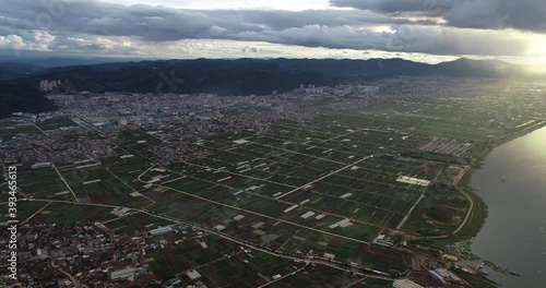 aerial view of agricultural plots of land under cultivation in an agricultural town. Tonghai County, Yuxi, Yunnan, China photo