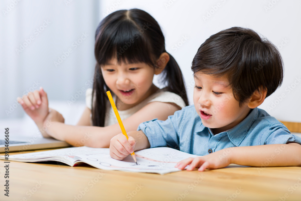 Little boy and girl doing homework Little boy and girl doing homework
