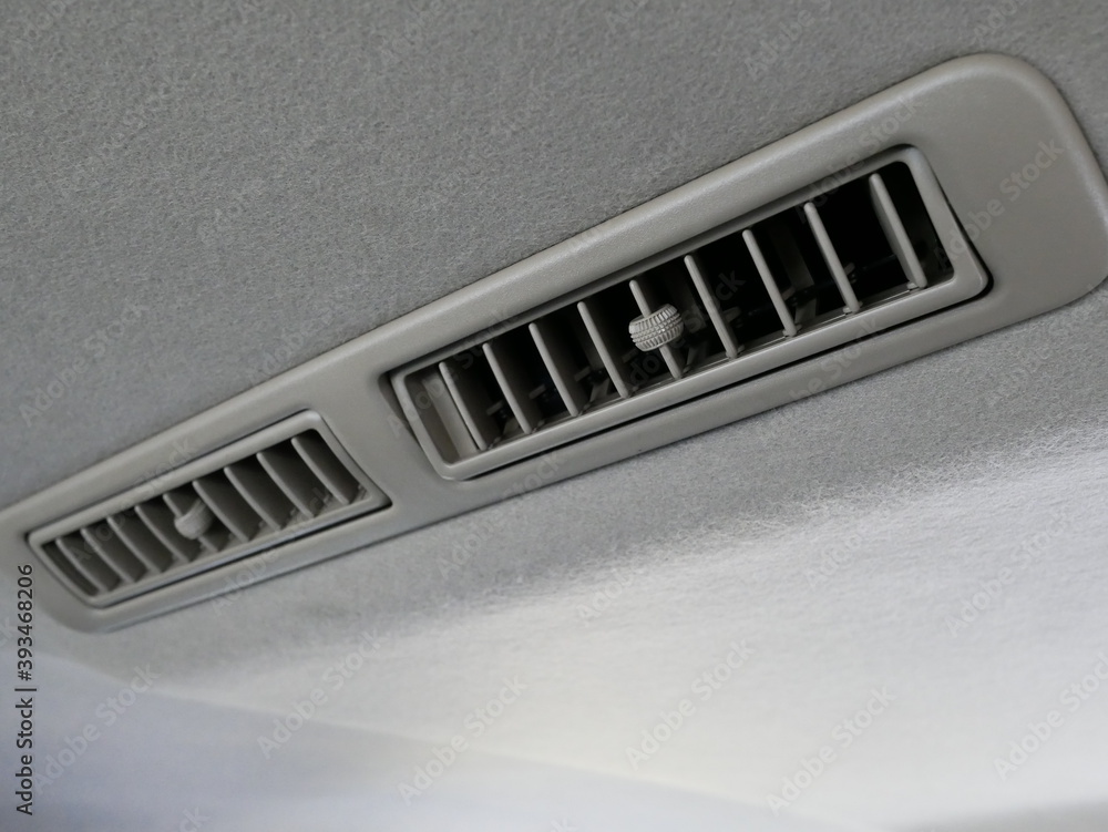 car air conditioner vent or duct installed on the ceiling. car air conditioner vent or duct installed on the ceiling.
