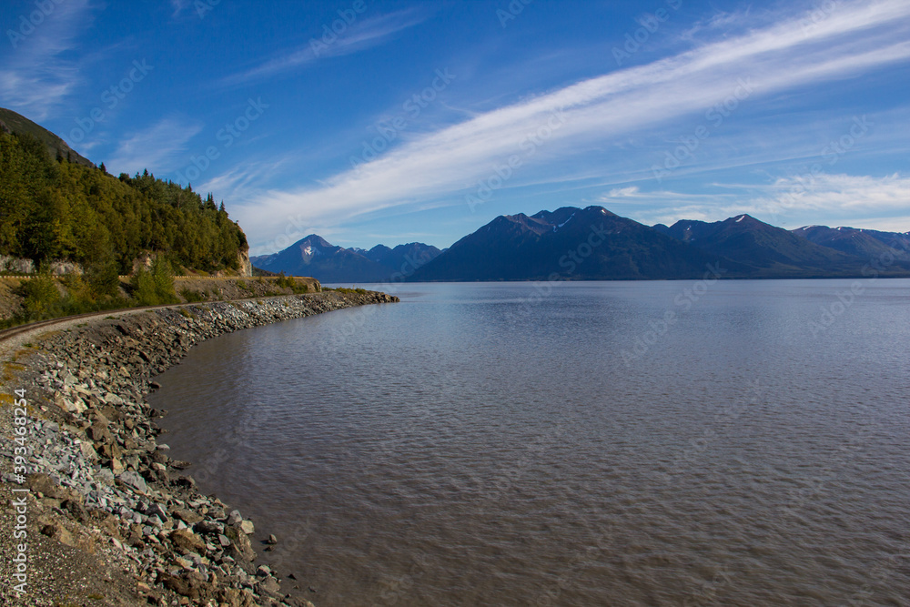 Whittier, AK / USA - Sept. 10, 2012: A view of the Wilderness rail service tracks running along the ocean between the cruise terminal in Whittier and Princess Denali-area wilderness lodges