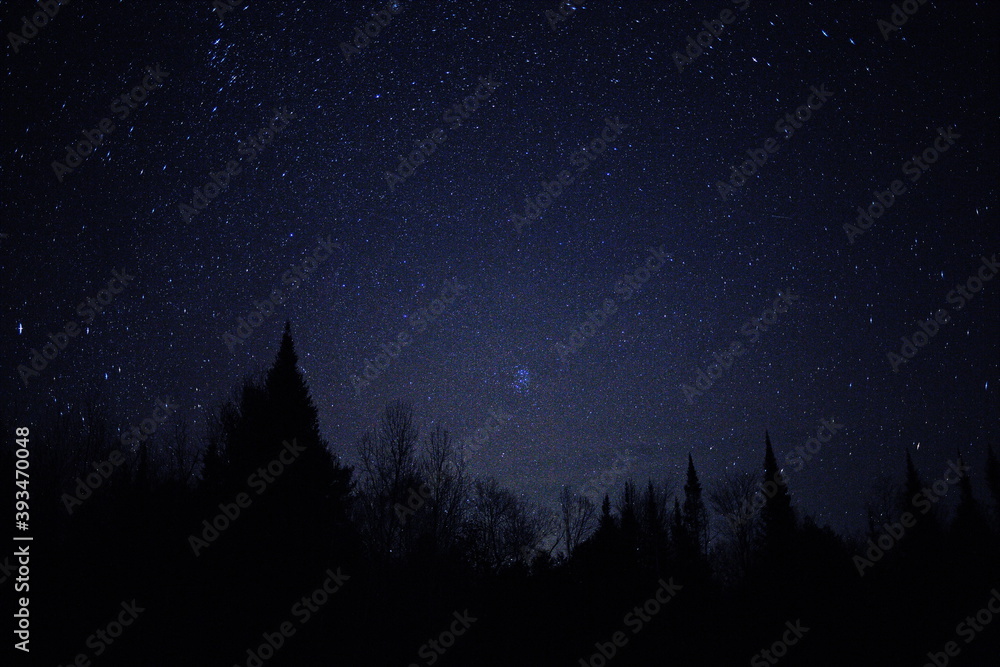 Naklejka premium Astrophotography image taken of constellation Pleiades in Ontario, Canada. Photo of the stars in the night sky during the autumn season.