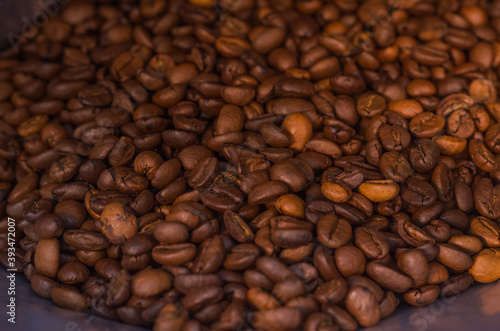 scattering of brown coffee beans  background and texture