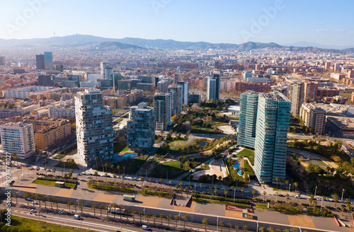 Aerial view of new residential complex of Diagonal Mar i el Front Maritim del Poblenou in sunny day, Barcelona, Spain..