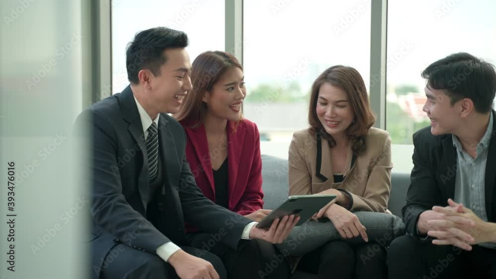 Business meeting lead by middle aged woman in modern living room, Group of asian business people entrepreneur on a meeting office background, Good teamwork discussion Business meeting lead by middle aged woman in modern living room, Group of asian business people entrepreneur on a meeting office background, Good teamwork discussion