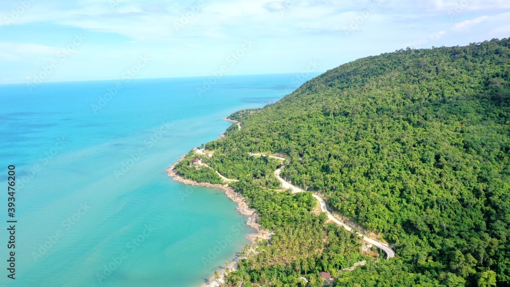 Beach and Sea and mountain Top View , Wave of Turquoise ocean water on sandy beach, High angle view sea and sand background, Aerial top view of Khanom beach, Khanom, Nakhon Si Thammarat Thailand 