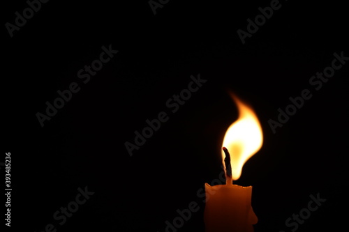 soft lens style burning candle on black background