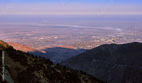 City at the mountain foothills at sunrise  Almaty town, Kazakhstan © kiwisoul