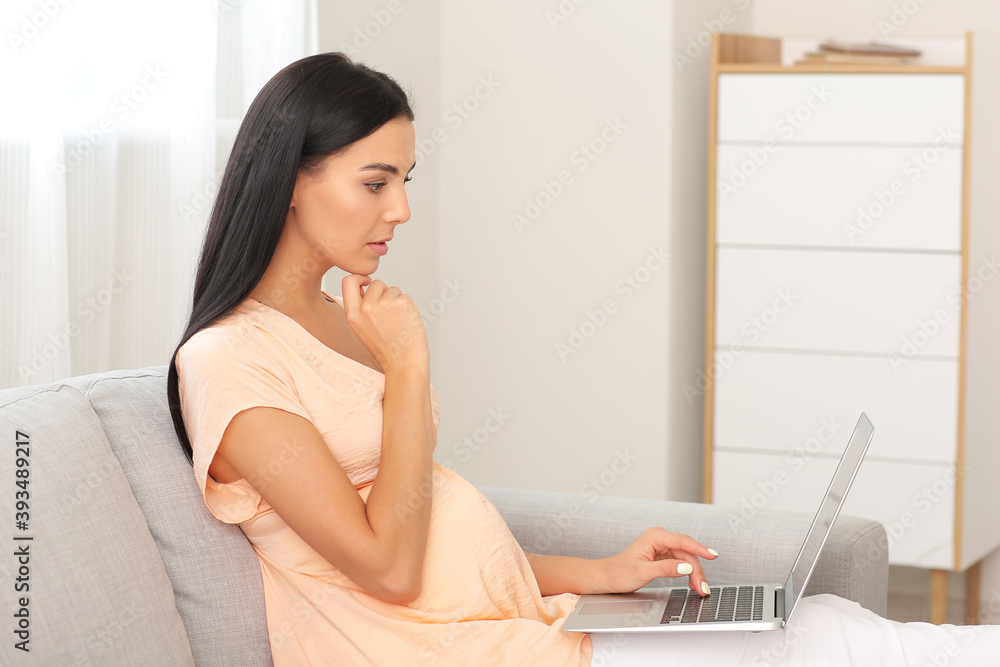 Young pregnant woman video chatting at home Young pregnant woman video chatting at home