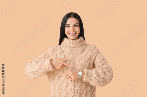 Young woman with wristwatch...