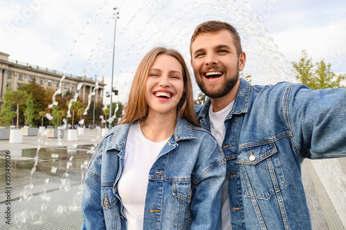 Young couple taking selfie ...