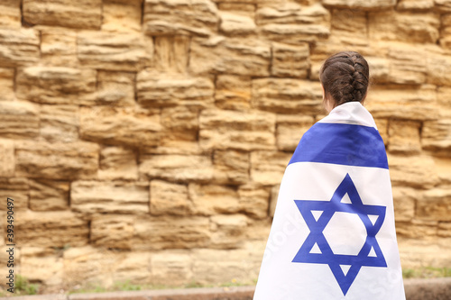 Fotografie Little girl with the flag of Israel near the Wailing Wall