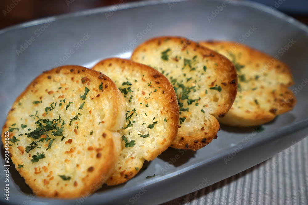 Close up dish of garlic and butter bread toast