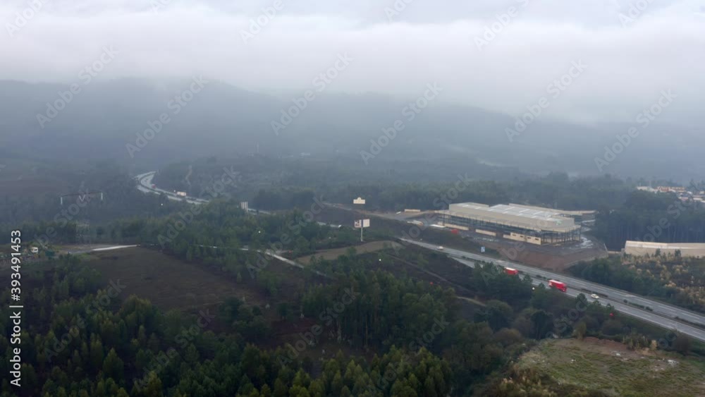 Aerial view of low clouds over a highway in Portugal. Aerial view of low clouds over a highway in Portugal.