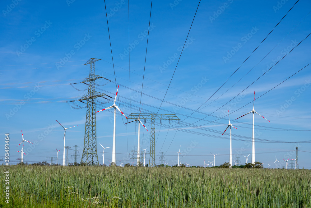 Power lines, electricity pylons and wind turbines seen in Germany Power lines, electricity pylons and wind turbines seen in Germany