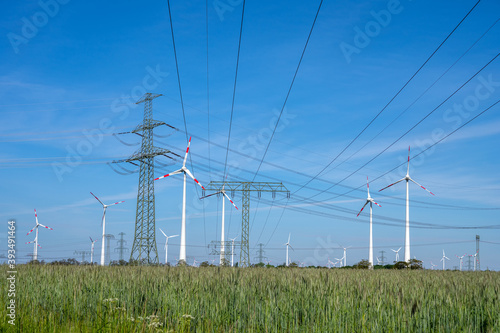 Power lines, electricity pylons and wind turbines seen in Germany © elxeneize