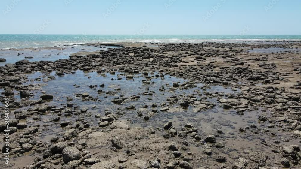 Low drone shot of Rock Pool and Ocean at East Point Reserve in Darwin, Northern Territory Low drone shot of Rock Pool and Ocean at East Point Reserve in Darwin, Northern Territory