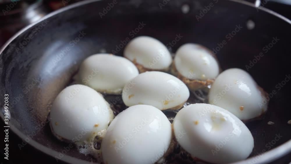 a pan-frying boiled egg in oil homemade Deviled egg also known as stuffed eggs, Russian eggs, or dressed eggs a pan-frying boiled egg in oil homemade Deviled egg also known as stuffed eggs, Russian eggs, or dressed eggs