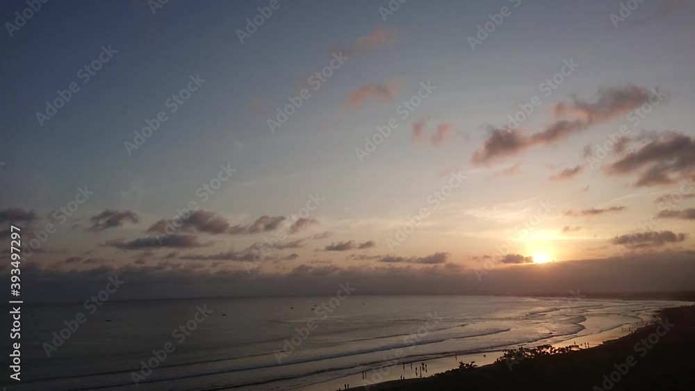 Time lapse, aerial view of people relax at Beach with the waves lapping on the beach, dramatic sky sunset scenery, landscape island Beautiful beach Time lapse, aerial view of people relax at Beach with the waves lapping on the beach, dramatic sky sunset scenery, landscape island Beautiful beach