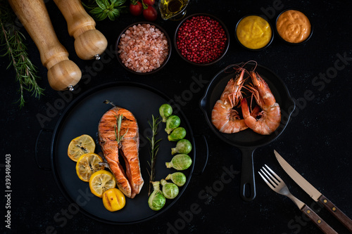 Delicious grilled meat in the plate with dark background