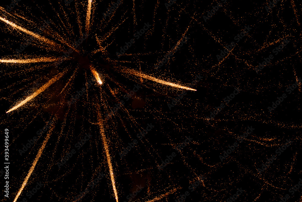 Fototapeta premium fireworks with yellow sparks on black background