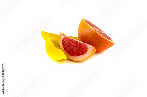 Juicy grapefruit halves and two mango slices