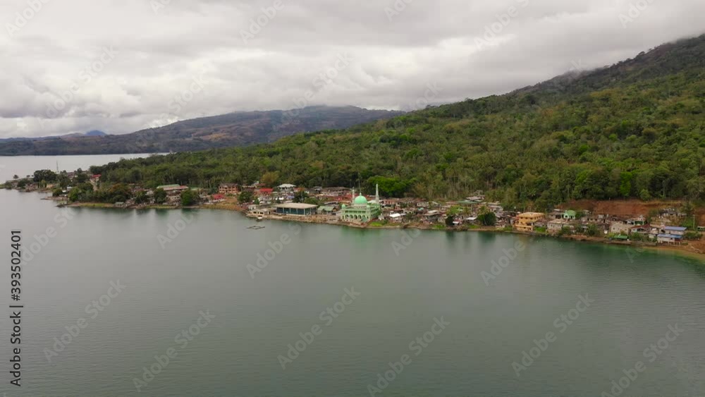 Aerial drone of Mosque on the shore of lake Lanao. Mindanao, Lanao del Sur, Philippines. Aerial drone of Mosque on the shore of lake Lanao. Mindanao, Lanao del Sur, Philippines.