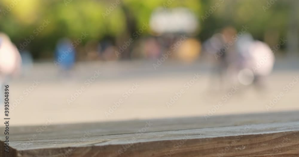 Close-up, a man takes a paper disposable glass of coffee with his hand in a blue glove from a street table. Close-up, a man takes a paper disposable glass of coffee with his hand in a blue glove from a street table.
