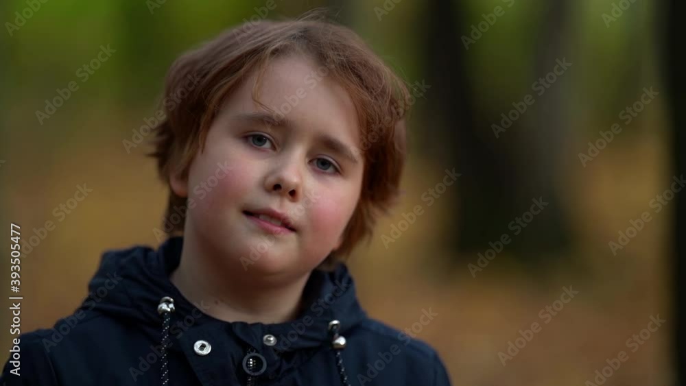 charming preschooler girl is smiling broadly standing on street in park at autumn day, closeup portrait charming preschooler girl is smiling broadly standing on street in park at autumn day, closeup portrait